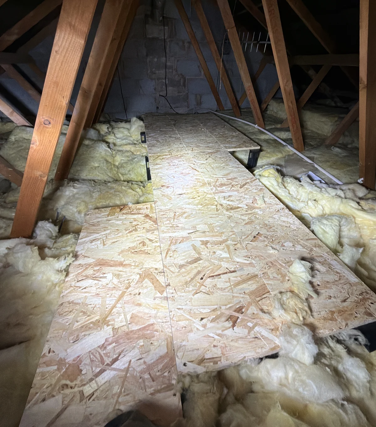 Raised loft boards surrounded by loft insulation